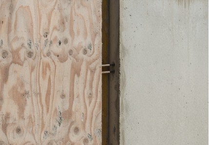 Rough concrete finish caused by poor quality shuttering ply