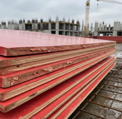 Swollen shuttering ply edges damaged by water exposure